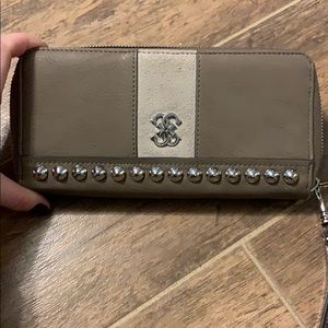 Tan wallet with card slots and zip coin slot